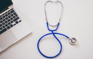 Stethoscope and computer for doctor's financial planning