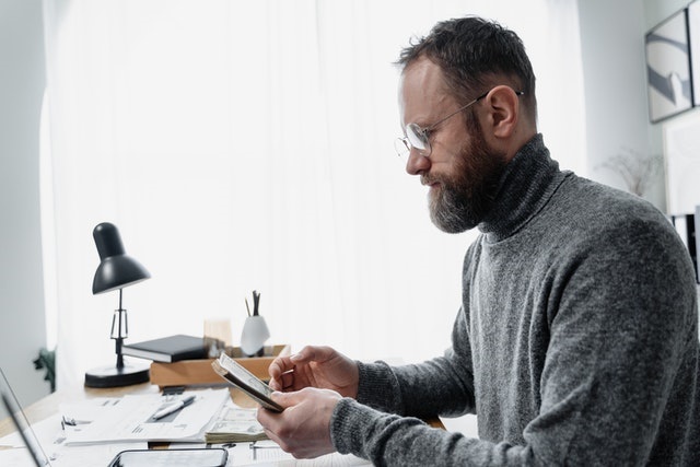 Man reviewing paycheck withholdings